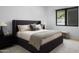 Cozy bedroom featuring a stylish bed, soft lighting, and elegant decor at 5814 E Camelback Rd, Phoenix, AZ 85018