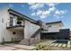 Stunning modern home with a pool, desert landscaping, and outdoor stairs leading to the second level at 5814 E Camelback Rd, Phoenix, AZ 85018