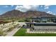 Expansive modern home exterior featuring a balcony and scenic mountain views at 5814 E Camelback Rd, Phoenix, AZ 85018