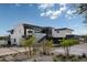 Beautiful exterior view showcasing a modern house with a pool, landscaping, and architectural design at 5814 E Camelback Rd, Phoenix, AZ 85018