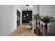 Modern hallway with sleek lighting, stylish console table, and black accent wall at 5814 E Camelback Rd, Phoenix, AZ 85018