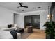 Bright living room featuring stylish decor, hardwood floors, and a cozy seating arrangement at 5814 E Camelback Rd, Phoenix, AZ 85018