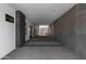 Long covered passageway with decorative concrete floors and walls of brick and concrete at 5814 E Camelback Rd, Phoenix, AZ 85018