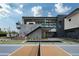 Backyard pickleball court with luxury home and pool in background at 5814 E Camelback Rd, Phoenix, AZ 85018