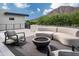 Relaxing rooftop deck with comfortable seating and modern fire pit, set against mountain views at 5814 E Camelback Rd, Phoenix, AZ 85018