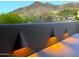 Balcony showcasing unique exterior lighting with a stunning mountain backdrop at 6001 E Restin Rd, Cave Creek, AZ 85331
