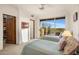 Charming bedroom featuring two twin beds, neutral carpet and a large window offering breathtaking views at 6001 E Restin Rd, Cave Creek, AZ 85331
