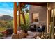 Relaxing covered patio with comfortable seating and desert landscape views at 6001 E Restin Rd, Cave Creek, AZ 85331