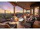 Inviting covered patio with scenic mountain views and cozy seating arrangements at 6001 E Restin Rd, Cave Creek, AZ 85331