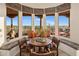 Cozy dining nook with stunning desert view and comfortable seating at 6001 E Restin Rd, Cave Creek, AZ 85331