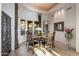 Elegant dining room featuring a round table and decorative mirror at 6001 E Restin Rd, Cave Creek, AZ 85331