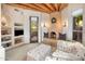 Inviting living room with a cozy fireplace, exposed wood beams, and comfortable seating at 6001 E Restin Rd, Cave Creek, AZ 85331