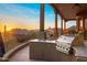 Outdoor kitchen on a covered patio with grill and scenic views at 6001 E Restin Rd, Cave Creek, AZ 85331