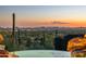 Tranquil pool overlooking a stunning desert landscape at sunset at 6001 E Restin Rd, Cave Creek, AZ 85331