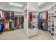 Spacious walk-in closet with ample storage and custom shelving at 6001 E Restin Rd, Cave Creek, AZ 85331