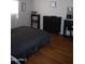 Bedroom with dark furniture and laminate wood flooring at 625 W Mckellips Rd # 279, Mesa, AZ 85201