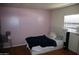 Bedroom with pink accent wall and wooden floors at 625 W Mckellips Rd # 279, Mesa, AZ 85201