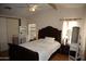 Inviting bedroom with bed, vanity, and wood flooring at 625 W Mckellips Rd # 279, Mesa, AZ 85201