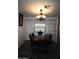 Dining room featuring a dark wood table and chairs under an ornate chandelier at 625 W Mckellips Rd # 279, Mesa, AZ 85201