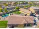 Home with a well-manicured lawn and a pool, nestled in a friendly neighborhood setting at 6763 W Wethersfield Rd, Peoria, AZ 85381