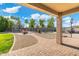 Expansive backyard with pavers, grassy area, in-ground pool, and trampoline offers the perfect outdoor recreation space at 6763 W Wethersfield Rd, Peoria, AZ 85381