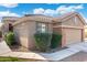 Charming single-story home featuring a tile roof, well-manicured landscaping, and a two-car garage at 6763 W Wethersfield Rd, Peoria, AZ 85381