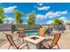 Cozy outdoor seating around a fire pit, perfect for entertaining friends at 6763 W Wethersfield Rd, Peoria, AZ 85381