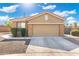 Attached two-car garage featuring stone accents and convenient driveway parking for residents and guests at 6763 W Wethersfield Rd, Peoria, AZ 85381