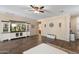 Living room displaying built-in entertainment center with tile floor at 6763 W Wethersfield Rd, Peoria, AZ 85381