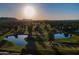 Picturesque golf course with ponds surrounded by mature trees and rolling greens at 7141 E Ironwood Dr, Paradise Valley, AZ 85253