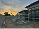 Backyard of a modern home under construction with pool framing and gray stucco exterior walls at 7141 E Ironwood Dr, Paradise Valley, AZ 85253