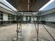 Courtyard construction shows scaffolding on modern gray building with large windows and a dirt ground at 7141 E Ironwood Dr, Paradise Valley, AZ 85253