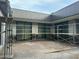 Modern gray building courtyard under construction with scaffolding and large windows at 7141 E Ironwood Dr, Paradise Valley, AZ 85253