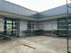 Modern gray building courtyard under construction with scaffolding and large windows at 7141 E Ironwood Dr, Paradise Valley, AZ 85253
