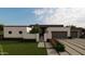 Modern home exterior features a two-car garage, minimalist landscaping, and neutral color palette at 7141 E Ironwood Dr, Paradise Valley, AZ 85253