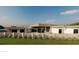 Contemporary home with a unique fence, lush green lawn and modern design at 7141 E Ironwood Dr, Paradise Valley, AZ 85253