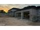Two-car garage highlighting modern architecture and construction, scaffolding for finishing work at 7141 E Ironwood Dr, Paradise Valley, AZ 85253