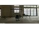 Bright living room under construction with concrete floors and expansive windows and sliding doors at 7141 E Ironwood Dr, Paradise Valley, AZ 85253