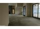 Spacious living room under construction featuring large sliding glass doors and a modern fireplace at 7141 E Ironwood Dr, Paradise Valley, AZ 85253