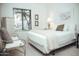 Bright bedroom featuring a large window and comfortable furnishings at 7575 E Indian Bend Rd # 1012, Scottsdale, AZ 85250