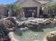 Community entrance with a water fountain at 7575 E Indian Bend Rd # 1012, Scottsdale, AZ 85250