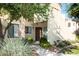 Inviting exterior with lush landscaping, a walkway, and a warm, welcoming facade at 7575 E Indian Bend Rd # 1012, Scottsdale, AZ 85250