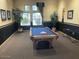 Community game room with a pool table and seating at 7575 E Indian Bend Rd # 1012, Scottsdale, AZ 85250