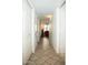 Hallway with tiled flooring and access to different areas of the home at 7575 E Indian Bend Rd # 1012, Scottsdale, AZ 85250