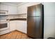 Well-lit kitchen featuring stainless steel refrigerator and white appliances at 7575 E Indian Bend Rd # 1012, Scottsdale, AZ 85250