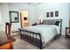 Comfortable main bedroom offering neutral carpeting, a side table and calming decor at 7575 E Indian Bend Rd # 1012, Scottsdale, AZ 85250