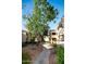 Community walkway with landscaped grounds and building exteriors at 7575 E Indian Bend Rd # 1012, Scottsdale, AZ 85250