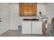 Functional laundry room with washer, dryer, cabinet storage, and utility connections at 8160 E Keats Ave # 339, Mesa, AZ 85209