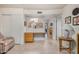 Open floor plan featuring tile flooring, neutral walls, and a charming archway leading to the kitchen at 8160 E Keats Ave # 339, Mesa, AZ 85209