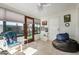 Comfortable sunroom features tile floors, abundant natural light, and a cozy seating area with a beanbag chair at 8160 E Keats Ave # 339, Mesa, AZ 85209